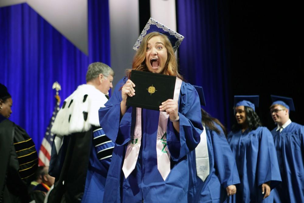 GVL / Emily FryeGrand Valley State University student celebrates receiving her diploma during graduation on Saturday April 29, 2017.