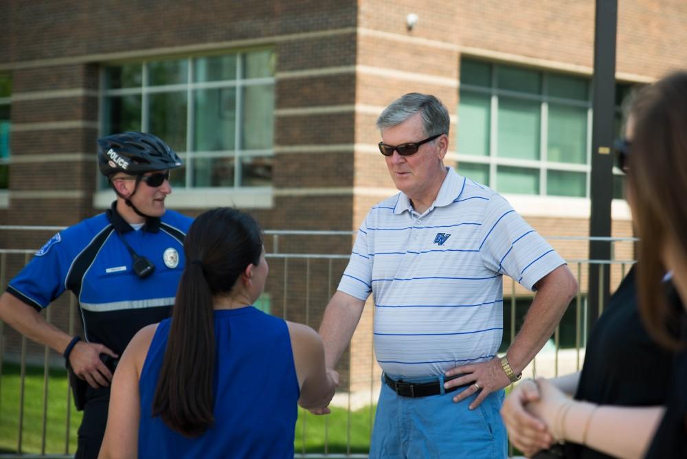 GVL / Luke Holmes - Students and faculty gather outside the Mary Idema Pew Library on their bikes. Bike Ride With T Haas was held Monday, June 12, 2017 to kickoff Active Commute Week.