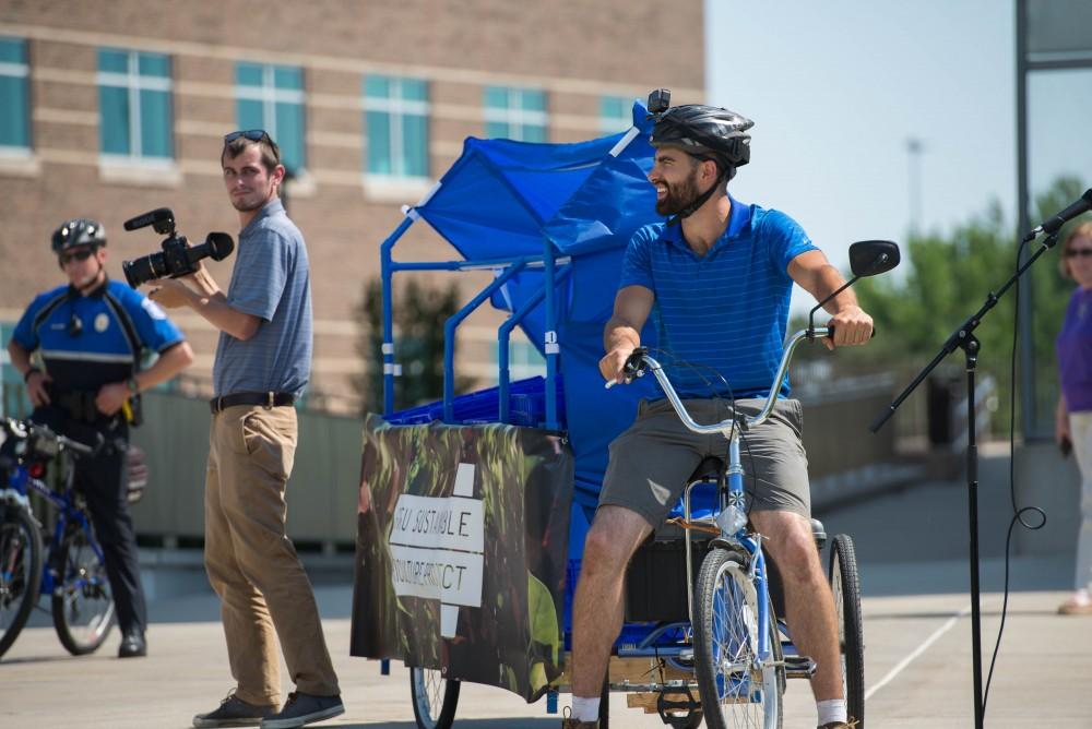 GVL / Luke Holmes - Youseff Darwich gets ready to roll on his Sustainable Agriculture Project bike. Bike Ride With T Haas was held Monday, June 12, 2017 to kickoff Active Commute Week.