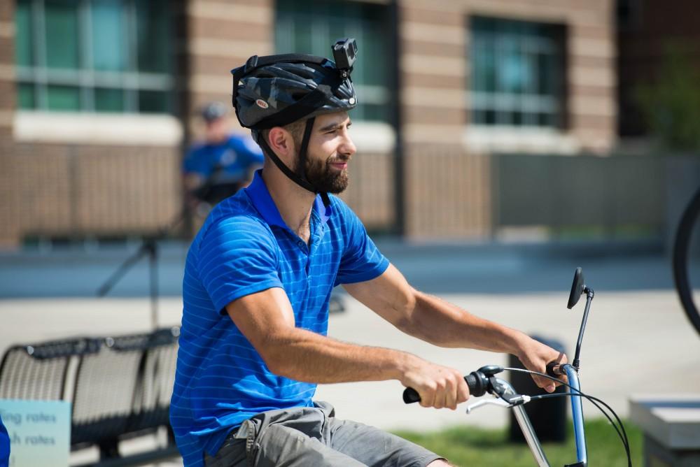 GVL / Luke Holmes - Youseff Darwich sets off on his bike. Bike Ride With T Haas was held Monday, June 12, 2017 to kickoff Active Commute Week.