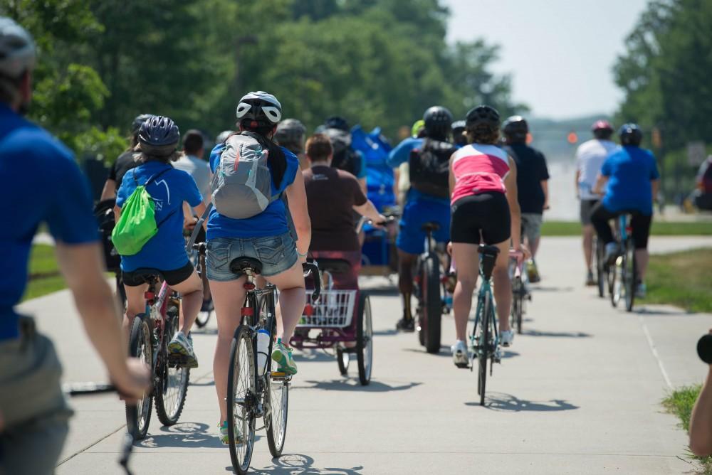 GVL / Luke Holmes - Students and faculty set off on their bikes. Bike Ride With T Haas was held Monday, June 12, 2017 to kickoff Active Commute Week.