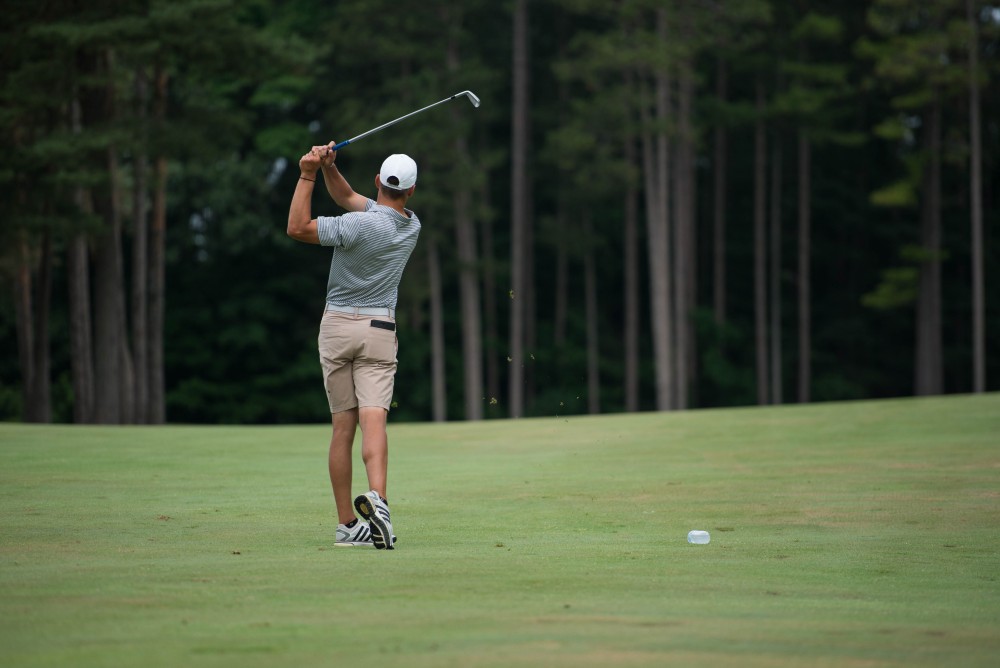 GVL / Luke Holmes - Grand Valley senior, Andrew Stevens, hits an iron from the fairway. The first round of match play for the Michigan Amateur was held at Egypt Valley Country Club on Thursday, June 22, 2017.