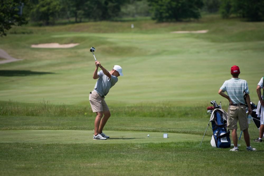 GVL / Luke Holmes - Grand Valley senior, Andrew Stevens, tees off. The first round of match play for the Michigan Amateur was held at Egypt Valley Country Club on Thursday, June 22, 2017.