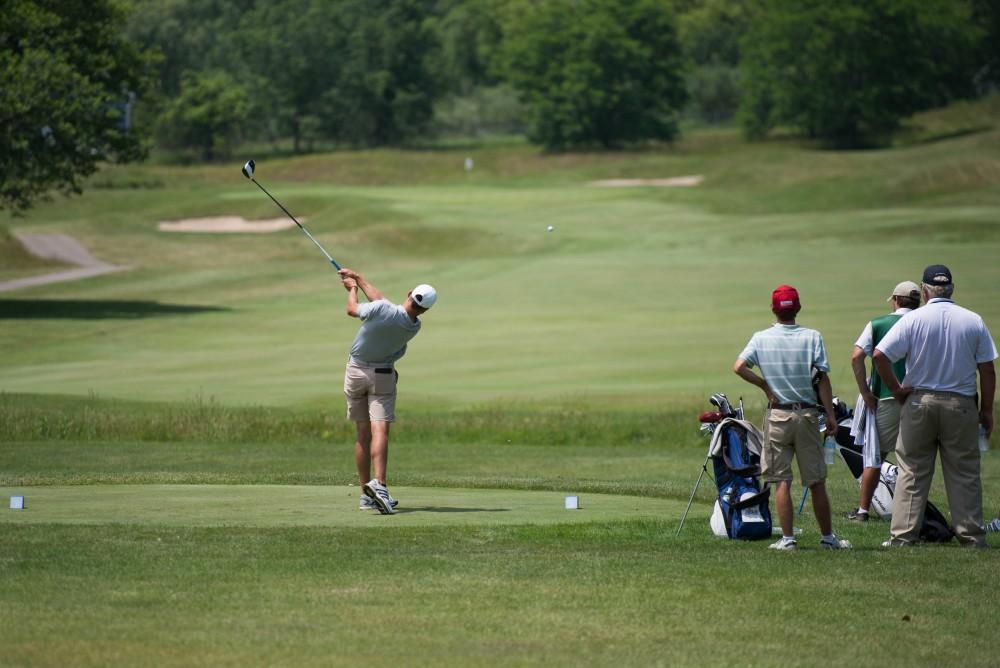 GVL / Luke Holmes - Grand Valley senior, Andrew Stevens, tees off. The first round of match play for the Michigan Amateur was held at Egypt Valley Country Club on Thursday, June 22, 2017.