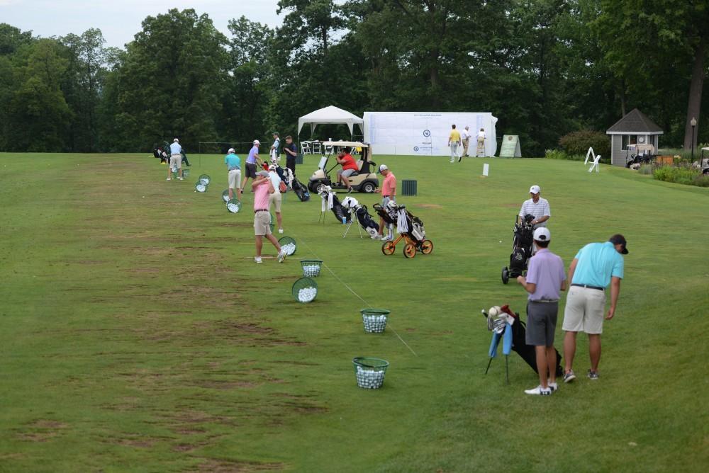 GVL / Luke Holmes - Players warm up on the range. The first round of match play for the Michigan Amateur was held at Egypt Valley Country Club on Thursday, June 22, 2017.