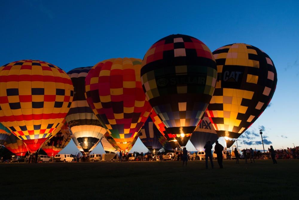 GVL / Luke Holmes - The sun sets behind the balloons. The Michigan Challenge Balloonfest was held in Howell, MI on Saturday, June 24, 2017.