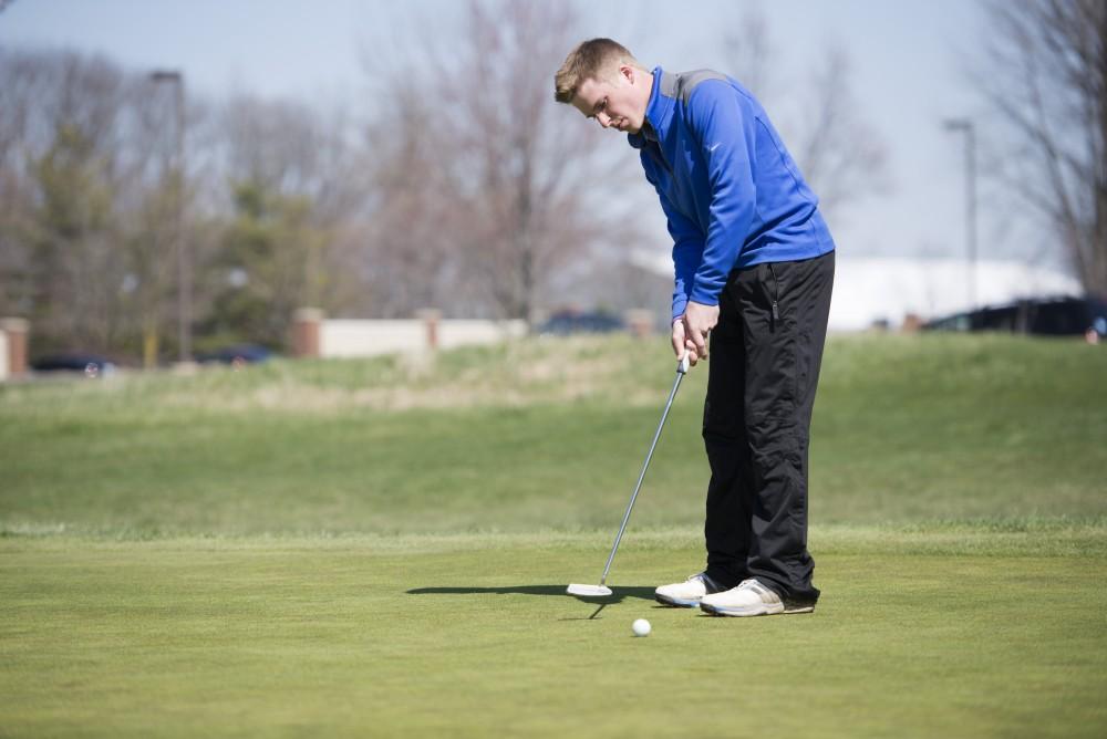 GVL / Luke Holmes - Alex Scott warms up on the practice green at The Meadows Golf Course Tuesday, Apr. 5, 2016.