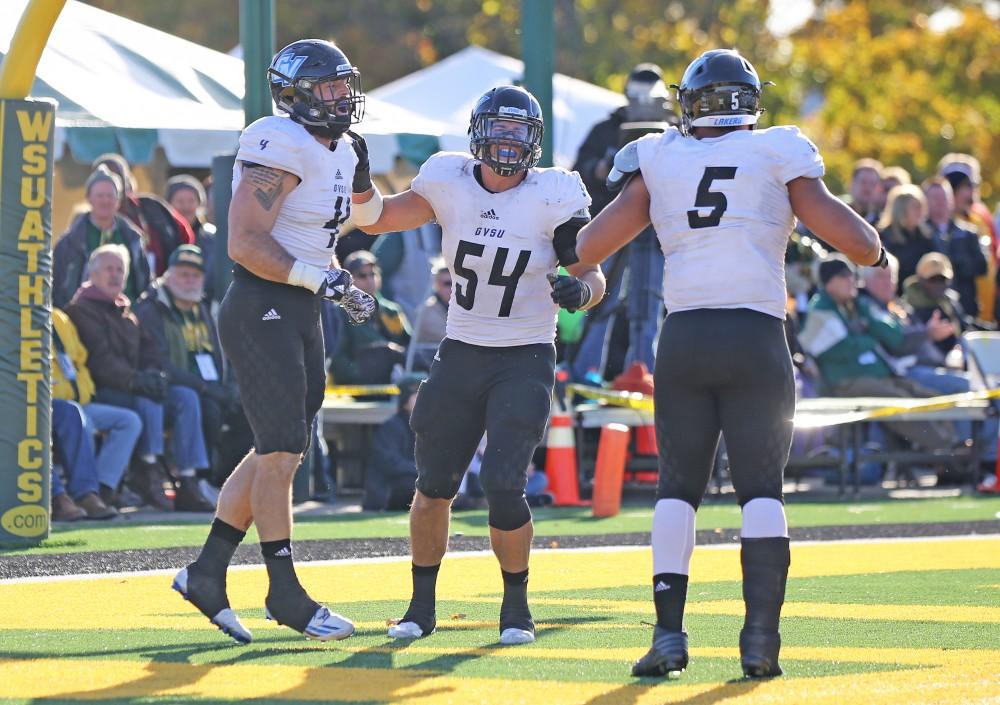 GVL / Emily Frye Alton Voss, Dylan Carroll, and DeOndre Hogan during the game against Wayne State University on Saturday Nov. 12, 2016