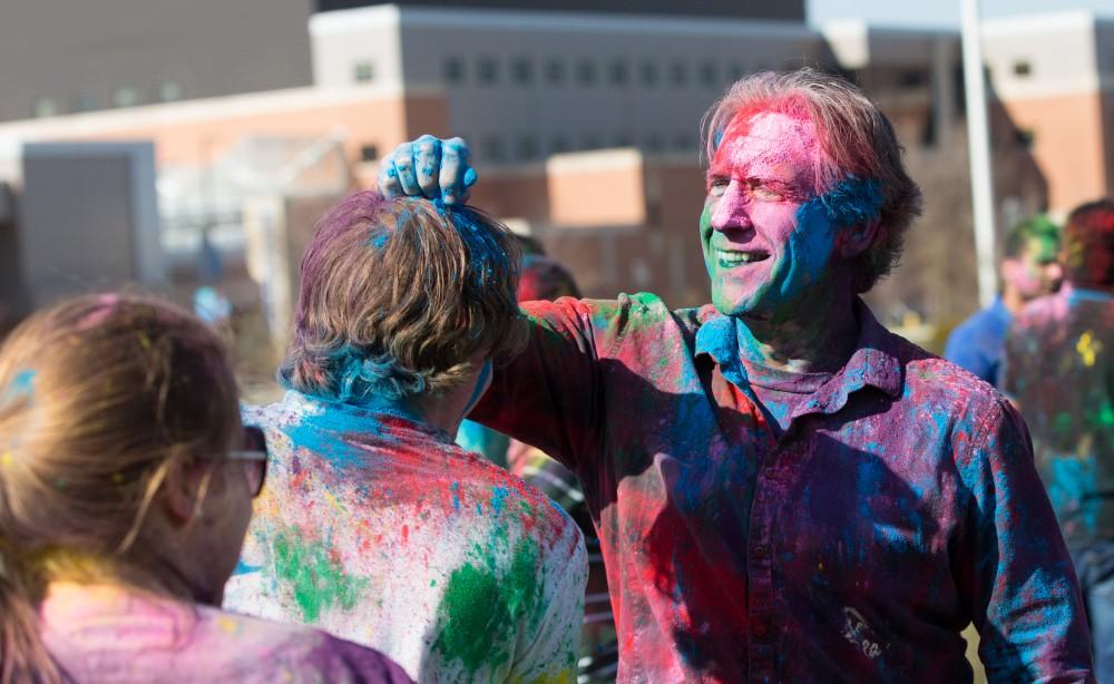GVL / Kevin Sielaff - Assistant Professor of Liberal Studies Brent Smith participates in Holi. Grand Valley celebrates India’s spring color festival, Holi, for the first time on Friday, April 15, 2016.