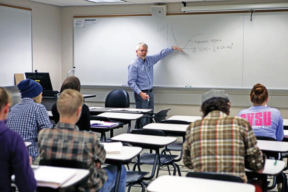 GVL / Emily Frye 
Professor George McBane, Ph.D., begins teaching his physical chemistry class on Oct. 9th. Professor McBane is the head of the chemistry department here at Grand Valley State University and also continues to conduct outside research. 