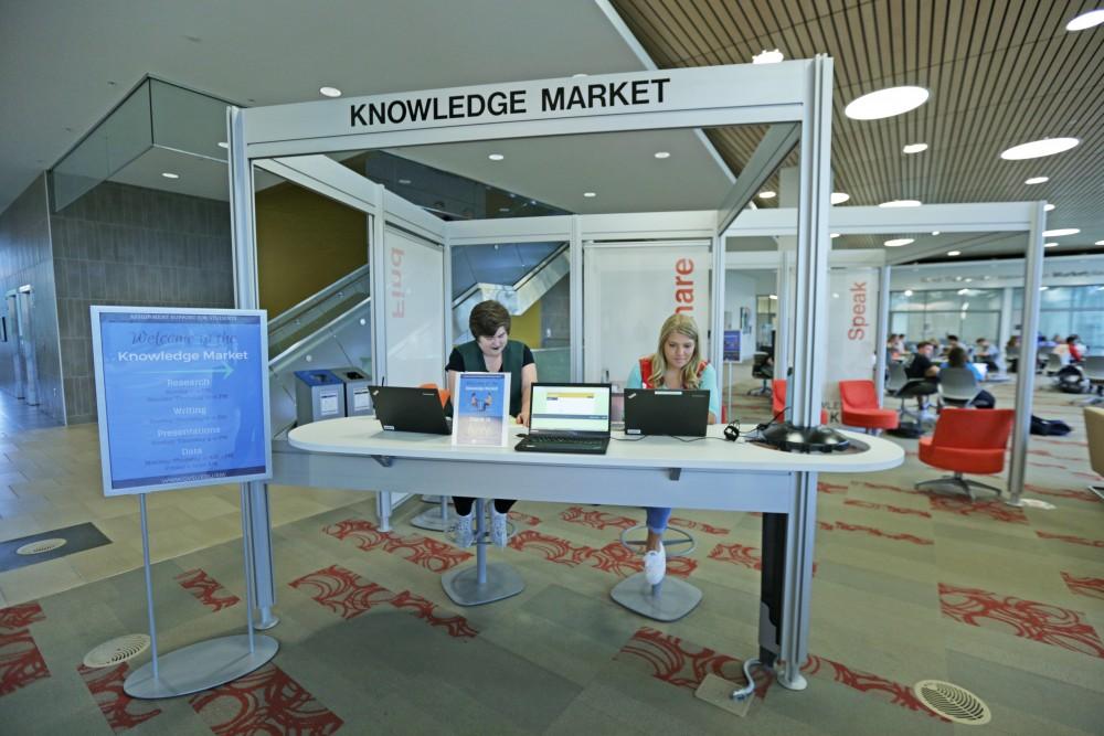 GVL / Emily Frye 
Ruth Ott and Natalie Loewengruber work at the Knowledge Market on Sunday September 17, 2017.