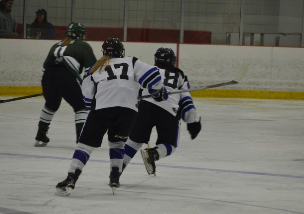 GVL/Hannah Zajac-- Alex Brinkman & Sammy Williams team up to play strong offense aganst MSU at Georgetown Ice Arena on Saturday 14 Oct 2017.