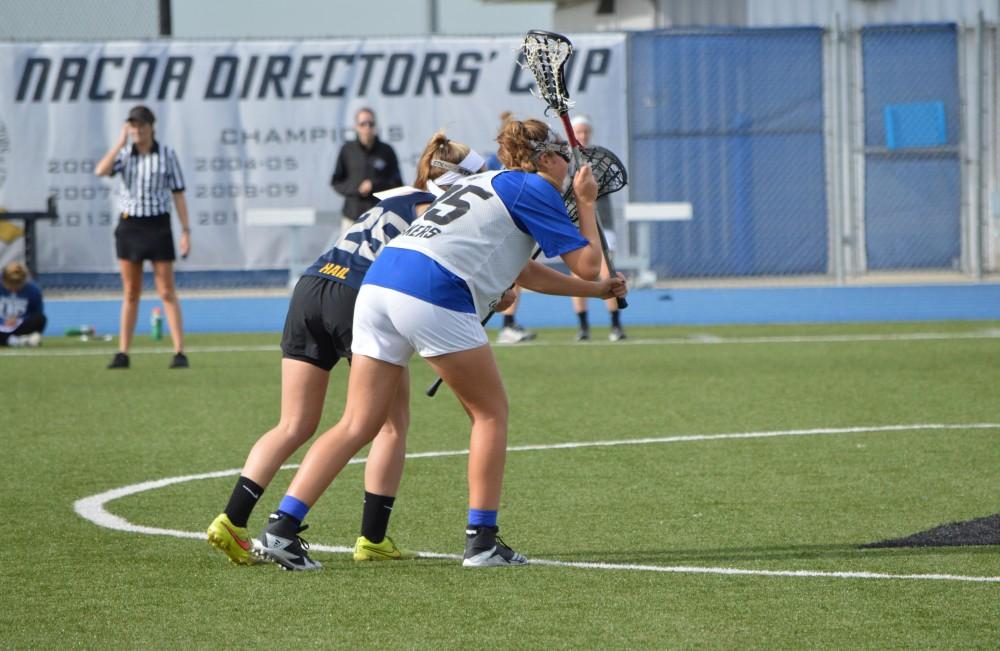 GVL/Hannah Zajac-- Sarah Stagaard plays strong defense against Michigan on Saturday 21 Oct 2017.