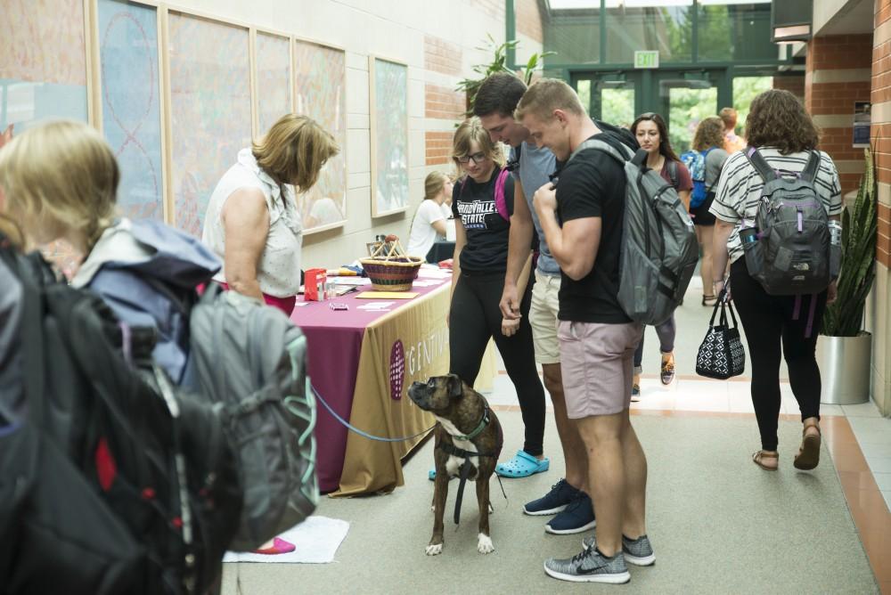 GVL / Luke Holmes - Students check out Becky Baker's therapy dog, Lilley. The Volunteer/Non-Profit Internship Fair was held in Henry Hall on Thursday, Sep. 8, 2016.