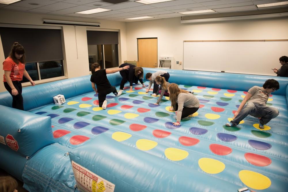 GVL/Luke HolmesKids play a giant version of twister in the Kirkhof Center for Sibs and Kids Weekend Friday, Jan. 29, 2016.