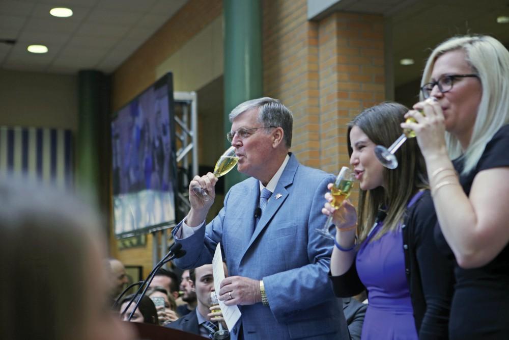 GVL / Emily FryePresident Thomas Haas, Ella Fritzemeier, and Sarah Daniels toast with the class of 2017 on Wednesday April 19, 2017.