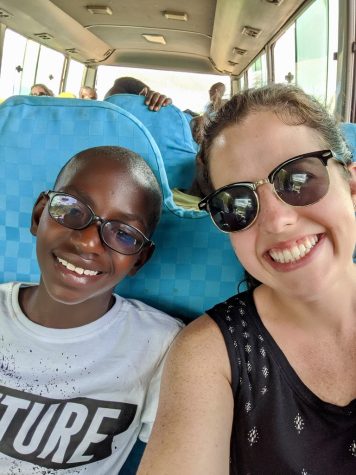 Presenter and GVSU alumni Allison Stephens Shook with a HFL program resident on a bus during a learning trip to Kigali. (Courtesy / Hope for Life)